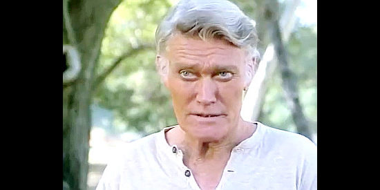 Chuck Connors as Nash Crawford, teaching gunfight lessons at an old-folks home in Once Upon a Texas Train (1988)