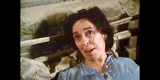 Dee Maaske as Mattie Earp, assuring Wyatt she has no intention of giving him a divorce in I Married Wyatt Earp (1983)