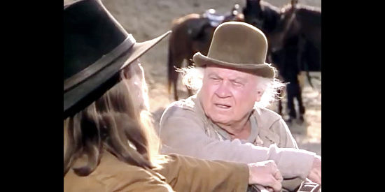 Dub Taylor as Charlie Lee, the wagon master for John Henry's gang in Once Upon a Texas Train (1988)