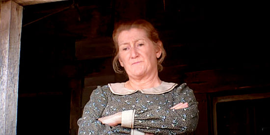 Fran Ryan as Mrs. Samuel, mother of Frank and Jesse, demanding to know why Pinkertons have come calling in The Long Riders (1980)