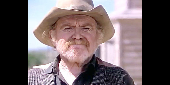 Gene Evans as Fargo Parker, a member of John Henry's gang in Once Upon a Texas Train (1988)