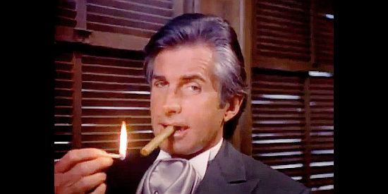 George Hamilton as John Moffit, who has a special place in his heart for cousin Alice and is her constant companion in Poker Alice (1987)