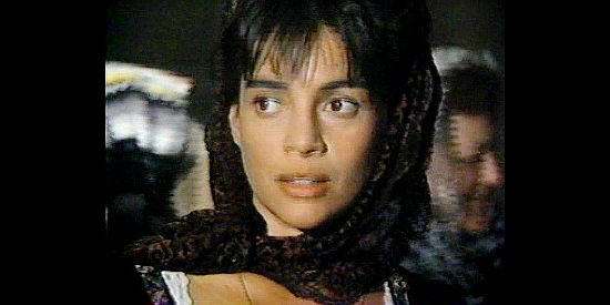 Julie Carmen as Celsa, the pretty widow Billy the Kid falls for in Billy the Kid (1989)