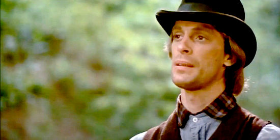Keith Carradine as Jim Younger, spotting two Pinkerton agents and potential trouble in The Long Riders (1980)