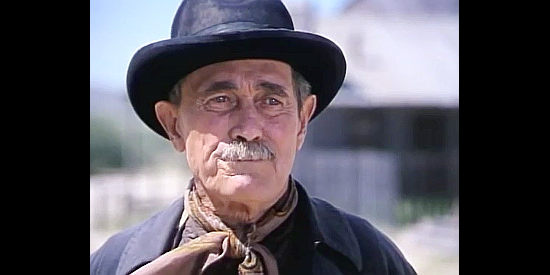 Ken Curtis as Kelly Sutton, a member of John Henry's gang in Once Upon a Texas Train (1988)