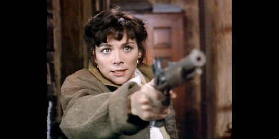 Kim Cattrall as Dora Adams, ready to defend her home and her child in Miracle in the Wilderness (1991)