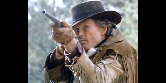 Kris Kristofferson as Jericho Adams, springing into action when his Christmas tree hunt is interrupted in Miracle in the Wilderness (1991)