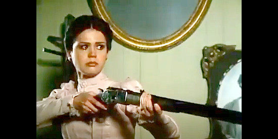 Marie Osmond as Josie Marcus, holding a gun on two cowboys when intended to ambush Wyatt at the O.K. Corral in I Married Wyatt Earp (1983)