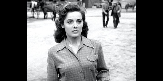 Mary Ellen Kay as Lucy Taylor, the storekeeper's daughter, spotting trouble in Vigilante Terror (1953)