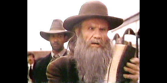 R.G. Armstrong as Uriah Creed, arriving to dispense his own justice to his sons in Independence (1987)