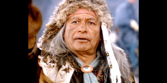 Rino Thunder as Shoshone Chief Washakie, explaining that Jericho, Dora and their son have been taken hostage by the Blackfeet in Miracle in the Wilderness (1991)