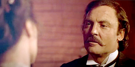 Stacy Keach as Frank James, finding a little time for romance between robberies in The Long Riders (1980)
