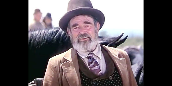 Stuart Whitman as George Asque, one of Oren Hayes' men in Once Upon a Texas Train (1988)