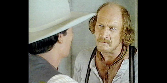 Taylor Lacher as Butch Bowden, the crooked Indian agent, being confronted by Josiah Anderson in The Avenging (1982)