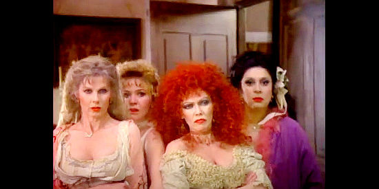 The girls who come with the 'house' won by Alice Moffit, including Mews Samll (left) as Baby Doe and Susan Tyrrell (third from left) as Mad Mary in Poker Alice (1987)