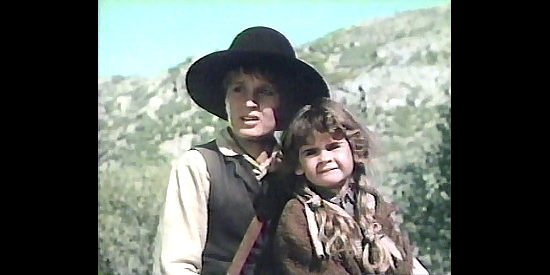Thomas Wilson Brown as Hardy Collins and Lisa MacFarlane as Betty Sue, searching for safety in Down the Long Hills (1986)