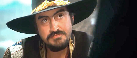 Alfred Molina as Angel, the man tasked with keeping Maverick from reaching an all-star poker match in Maverick (1994)