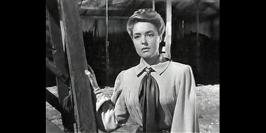 Ann Richards as Henryetta Alcott, a newspaper editor with a law and order message in Badman's Territory (1946)