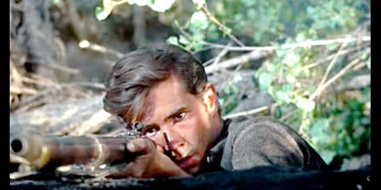 Anthony Perkins as Josh Birdwell, staring down his rifle at approaching Confederates in Friendly Persuasion (1956)
