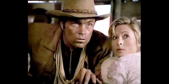 Art Hinkle as Cole Everett, trying to keep new mom Sally Wells (Lori Hallier) safe in The Gunfighters (1987)