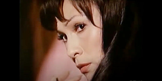 Barbara Luna as Soledad Villegas, Devlin's lover, realizing he's not dead in The Hanged Man (1974)