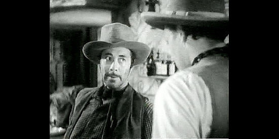 Bernard Nedell as Tod Shelby, the fast gun who terrorizes Santa Marta in Rangers of Fortune (1940)