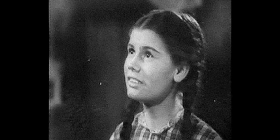 Betty Brewer as Mary 'Squib' Clayborn, conspiring to help Gil Farra romance Sharon in Rangers of Fortune (1940)