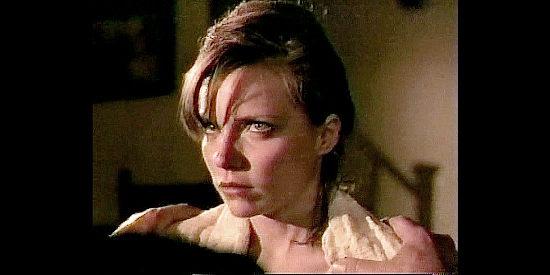 Beverly Hendry as Kate Burrows, the sheriff's daughter who witnesses Matt's first killing in The Gunfighters (1987)