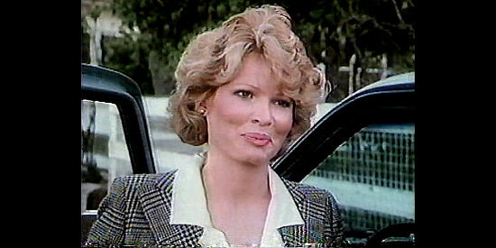 Christine Belford as Lt. Magie Randall, the lady police officer who's neighbors to the 'outlaws' in Outlaws (1986)