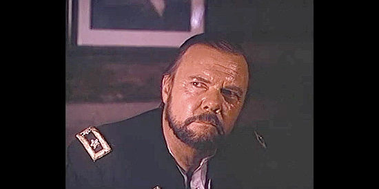 Don Donovan as Gen. Charles Adams, listening to Alfred Packer's confession in The Legend of Alfred Packer (1980)
