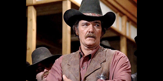 Ed Bruce as Sheriff Tom Guthrie, watching to make sure a poker game doesn't devolve into a shootout in Bret Maverick, The Lazy Ace (1981)