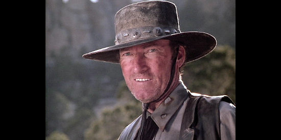 Ed Lauter as John Slade, the villain sent to stop the Wagons East movement in Wagons East (1994)