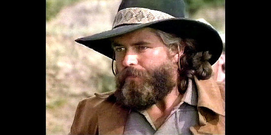 Francis Dambertger as Sam Martin, leader of the outlaw gang the Everetts join in The Gunfighters (1987)