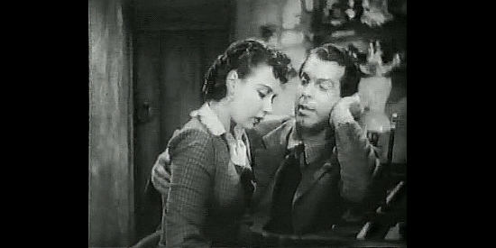 Fred MacMurray as Gil Farra romancing Sharon McCloud (Patricia Morison) with the help of piano lessons in Rangers of Fortune (1940)