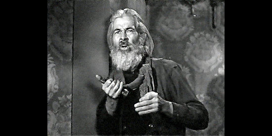 Gabby Hayes as The Coyote Kid, getting his first glimpse of Henryetta in her party dress in Badman's Territory (1946)