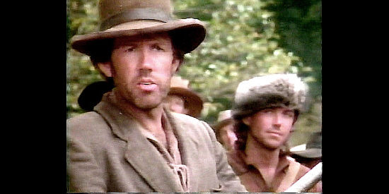 Gary Grubbs as George Russell, the one volunteer who objects to Davy being appointed sergeant, yet becomes his good friend in Davy Crockett, Rainbow in the Thunder (1988)(