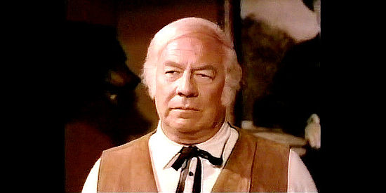 George Kennedy as Deke Turner, the land-hungry town boss who wants the Everett ranch in The Gunfighters (1987)