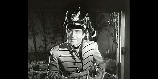 George Montgomery as Joe Dawson, happily catching Carolyn in her petticoats in Ten Gentlemen from West Point (1942)