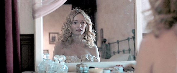 Heather Graham as Anna, a whore realizing the consequences of her actions in The Last Son (2021)