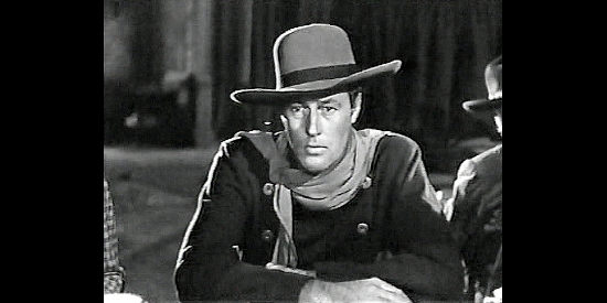 James Warren as John Rowley, listening to the Daltons plan their Coffeyville raid in Badman's Territory (1946)