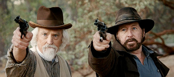 Jim Tucker as retired sheriff Tucker and Willy Ortlieb as bounty man Tate, ready for action in Lost Outlaw (2021)