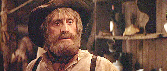 Kirk Douglas as Spur, the aging miner who was once in love with Jessica's mother, Matilda, in The Man from Snowy River (1982)