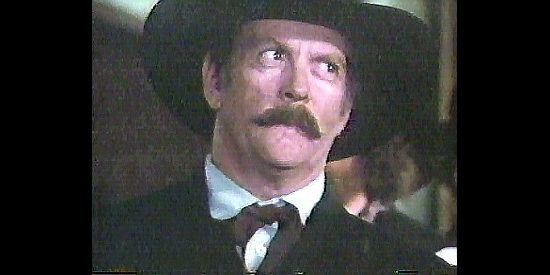 Lee de Broux as Sheriff Garrett, a man in cahoots with Mayor Blalock in Longarm (1988)