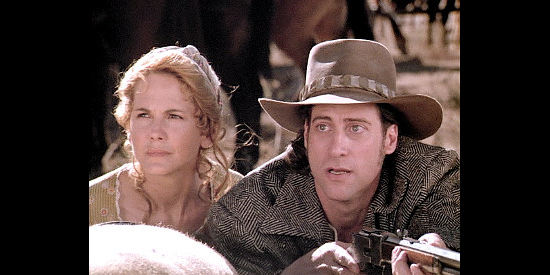 Melinda Culea as Constance Taylor and Richard Lewis as Phil Taylor await an attack by the U.S. Cavalry in Wagons East (1994)