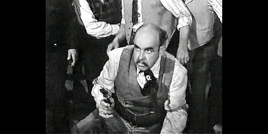 Nestor Paiva as Sam Bass, in a showdown with Mark Rowley over stolen money from a horse race in Badman's Territory (1946)