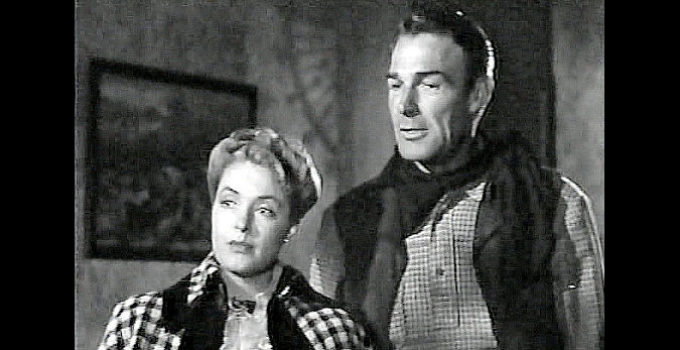 Ann Richards as newspaper editor Henryetta Alcott with Sheriff Mark Rowley (Randolph Scott) in Badman's Territory (1946)