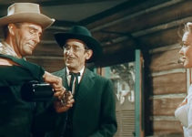 Randolph Scott as Jim Redfern, Victor Jory as Frank Walsh and Karin Booth as Frances Harrison in The Cariboo Trail (1950)