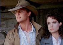 Tom Burlinson as Jim Craig and Sigrid Thornton as Jessica, standing together against adversity in Return to Snowy River (1988)