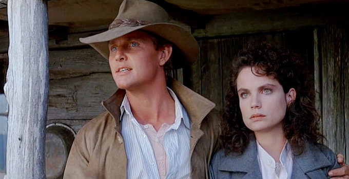 Tom Burlinson as Jim Craig and Sigrid Thornton as Jessica, standing together against adversity in Return to Snowy River (1988)