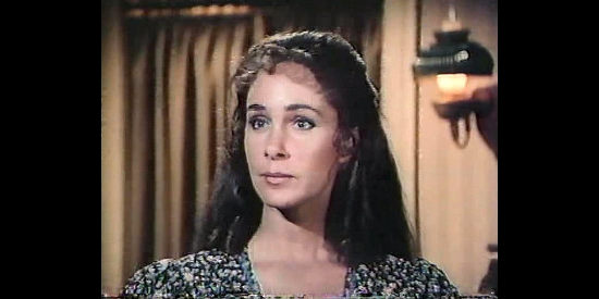 Pamela Bellwood as Sarah, whose husband and young son are both attracted to Sugar in The Wild Women of Chastity Gap (1983)